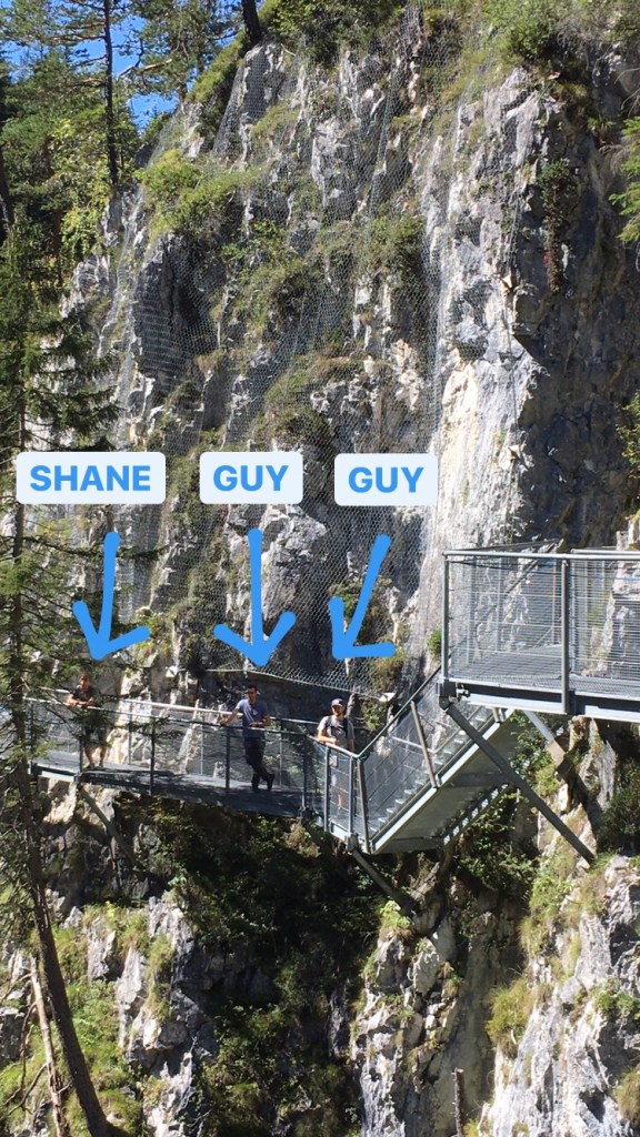 Guys lined up to take pictures of their girlfriends.